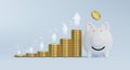 Increasing golden coins stacking with up arrow graph and white piggy bank, Money saving for investment and financial planing Royalty Free Stock Photo
