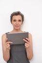 Increasing her business productivity with technology. Portrait of a mature businesswoman holding a digital tablet.