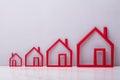 Increasing Outline Of Red Houses Royalty Free Stock Photo