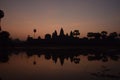 Orange sunrise over famous angkor wat temple with lake and reflection in the water with lillypad Royalty Free Stock Photo