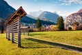 Incredible autumn view of Triglav mountain range and Gozd Martuljek village. Sunny morning scene of Julian Alps, Slovenia, Europe.