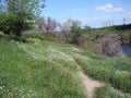 Panorama of blooming spring nature on the rocky shores of the Dnieper island of Khortytsia. Royalty Free Stock Photo