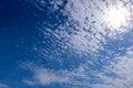 Incredible blue sky with fluffy white clouds. Beautiful cloud patterns in sun rays, peace and tranquility. Best background Royalty Free Stock Photo