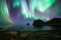 Incredible dramatic northern lights at haukland beach on lofoten islands norway Royalty Free Stock Photo