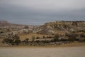 Incredible and fabulous scenery of the rock mountains, the road leads to the city of Amonos and Goreme. Cappadocia, Turkey Royalty Free Stock Photo