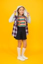 For incredible girl. Happy girl in hood yellow background. Cute little girl smile in hooded jacket. Adorable small girl Royalty Free Stock Photo