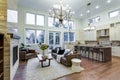 Incredible light and airy living room with high ceiling in a new construction home. Royalty Free Stock Photo