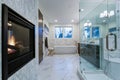 Incredible marble bathroom with fireplace. Royalty Free Stock Photo