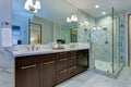 Incredible master bathroom with Carrara marble tile surround. Royalty Free Stock Photo