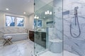 Incredible master bathroom with Carrara marble tile surround. Royalty Free Stock Photo