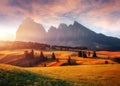 Incredible Nature Landscape. Awesome Dolomites Alps during sunrise. Fairytale green alpine plateau Seiser Alm Alpe di Siusi with