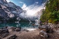 Incredible Nature Landscape. foggy morning during sunrise at Alpine lake in autumn. Perfect Sky over the Lake Baies or Lago di