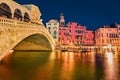 Incredible night scene of famous Canal Grande. Illuminated houses and Rialto Bridge. Fabulous summer cityscape of Venice, Italy,