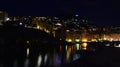 Incredible night view of the seaside town of Camogli with lights, colors and reflections in a magical atmosphere