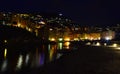 Incredible night view of the seaside town of Camogli with lights, colors and reflections in a magical atmosphere