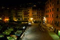 Incredible night view of the seaside town of Camogli with lights, colors and reflections in a magical atmosphere