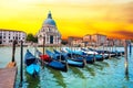 Incredible optimistic color landscape of gondolas on the Grand Canal in the background Basilica Santa Maria della Salutein at dawn Royalty Free Stock Photo