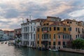 Incredible sunset, clouds and traditional venetian architecture seen from the grand canal in Venice, Italy