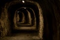 Incredible tunnel carved into the mountain stone to build a trecking pedestrian path Royalty Free Stock Photo