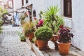 Incredible Turkey, Kas. Narrow traditional street with flower pots. Authentic street descends down to the sea. The city is located