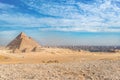 Incredible view of the complex of ancient pyramids against the background of the incredible sky on a hot day Royalty Free Stock Photo