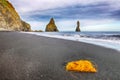 Incredible view of  rock formations Troll Toes on Black beach Reynisfjara near the village of Vik Royalty Free Stock Photo