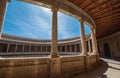 Incredible wide-angle view of galleries with columns in the inner circular patio in Palace of Charles V in Alhambra complex in Royalty Free Stock Photo