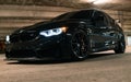 Incredibly amazing jaw dropping metallic black BMW M3 CS m power sports front car with angel lights