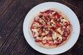 Incredibly delicious strawberry pizza . Pizza with strawberries . Original pizza with cheese and strawberries on wooden table.top