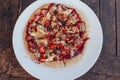 Incredibly delicious strawberry pizza . Pizza with strawberries . Original pizza with cheese and strawberries on wooden table.top