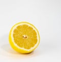 Incredibly joyful yellow lemon with a drop of juice.