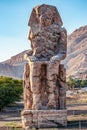 Incredibly magnificent and ancient statues of Colossi on the west bank of the Nile. Colossi Memnon Royalty Free Stock Photo