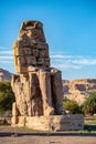 Incredibly magnificent and ancient statues of Colossi on the west bank of the Nile. Colossi Memnon Royalty Free Stock Photo