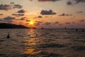 Incredibly picturesque landscape with a view of the waves in the ocean and the bronze sun at the golden hour at sunset in thailand