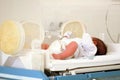 Incubator for newborns: baby sleeping Royalty Free Stock Photo