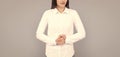 indecisive businesswoman in white shirt on grey background, ceo Royalty Free Stock Photo