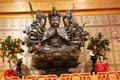 An indefinite sacred religious statue of a Chinese Buddhist temple. Bright colors and orange background