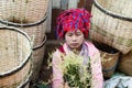 Indein, Myanmar - March 2019: Burmese woman sells bamboo baskets on the street market