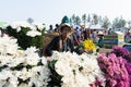 Indein, Myanmar - March 2019: Burmese woman sells chrysanthemum flowers on the street market