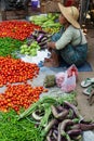 Indein, Myanmar - March 2019: Burmese woman sells vegetables on the street market