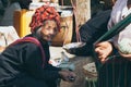 Indein, Myanmar - March 2019: old Burmese woman from PaO dragon people tribe on the street market at Inle lake