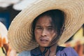 Indein, Myanmar - March 2019: portrait of a young Burmese woman in a big straw hat