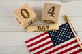 Indepandence and democrasy. Top view on wooden cubr calendar with 4 of July date and USA flag Royalty Free Stock Photo