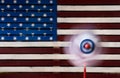 Pinwheel or whirligig in front of US flag Royalty Free Stock Photo