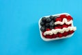 Independence day, happy fourth of july and sweet dessert concept with the american flag made of raspberries, blueberries and Royalty Free Stock Photo