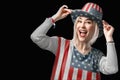 Independence Day. Happy young woman dressed in american flag clothes on black background Royalty Free Stock Photo