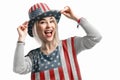 Independence Day. Happy young woman dressed in american flag clothes on white background Royalty Free Stock Photo