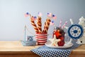 Independence Day, 4th of July  festive table setting  with summer fresh fruit drink, twisted hot dog sausages and nautical Royalty Free Stock Photo