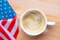 Independence Day USA concept. Memorial Day. Cup of coffee with American flag on white background top view