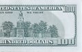 Independence Hall on 100 dollars banknote back side closeup macro fragment. United states hundred dollars money bill